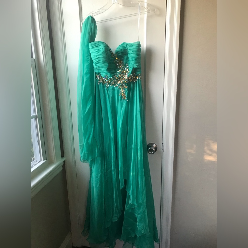 The brand is Cinderella. The size is a 6, and the color is Jade.